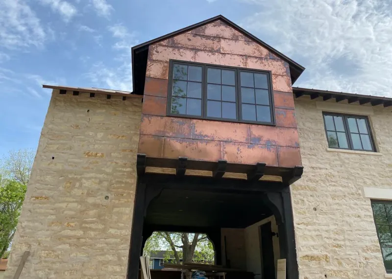 Copper metal panel facade on a stone building for Skylight Installation in Pennsville